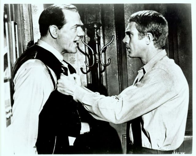 Shooter (played by Karl Malden) is accused 
of cheating by Eric (McQueen).